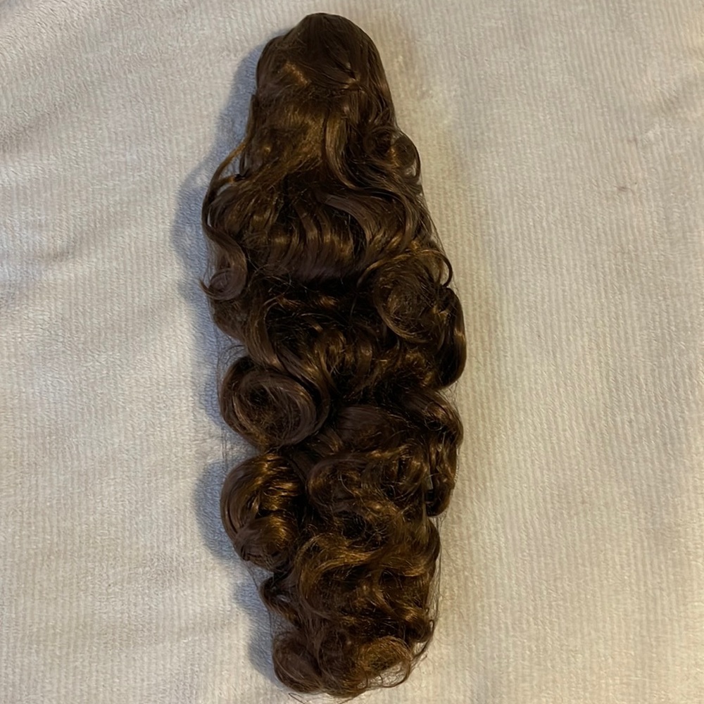 Hair extension with a clip